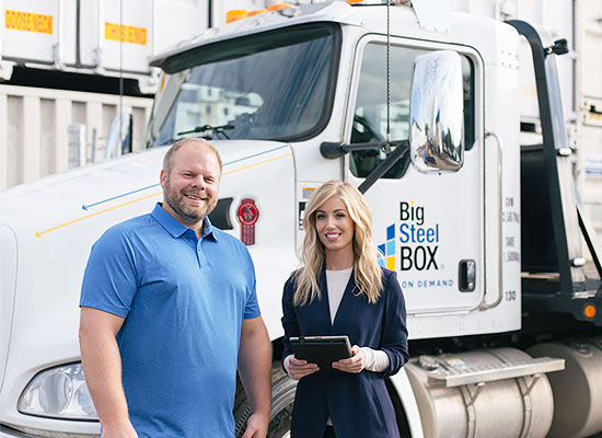 BigSteelBox staff with a container delivery truck
