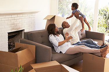 Family with toddler unpacking after move
