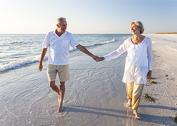 Retired couple on beach - where do you want to live after retiring?